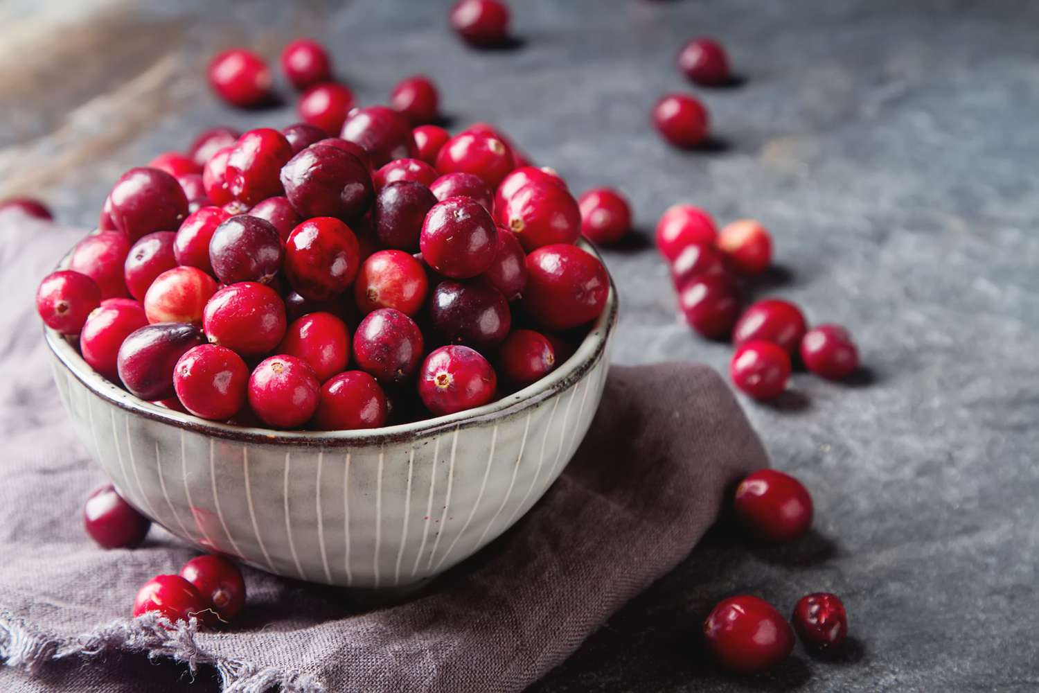 fresh cranberries in ceramic bowl