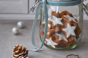 Christmas background with tasty star ginger cookies in a glass j