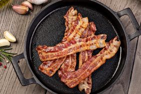 Closeup of slices of crispy hot fried bacon