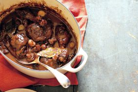 coq au vin with serving spoon