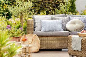 backyard furniture with pillows and decor