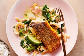 crispy salmon with coconut-ginger collards served with fresh cilantro