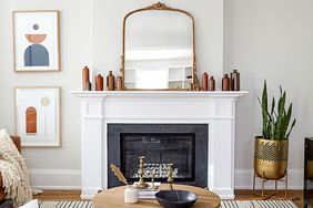 Fireplace with white mantel and large mirror