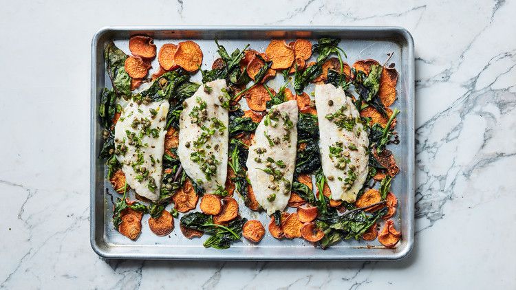 fish and vegetables on baking sheet