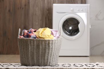 laundry in front of washing machine