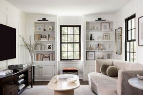 a white room with bookshelves