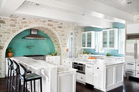 Modern, light kitchen with blue tile