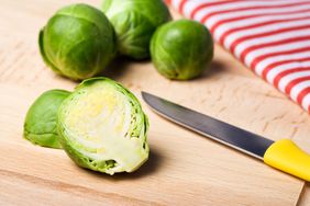 cut brussles sprouts on cutting board