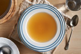 bone broth in blue/white soup bowl