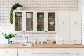 Kitchen at modern house with white interior design and cabinets