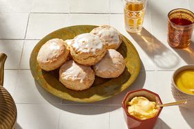 lemon ginger scones on plate next to butter dish