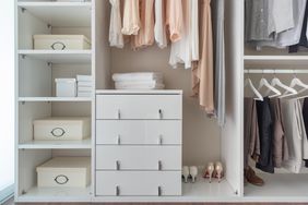 modern closet with dresser on floor