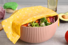 Bowl of salad covered with beeswax food wrap