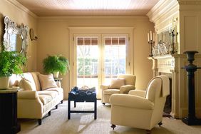 butter yellow living room near French doors