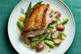 overhead view of a chicken dish with asparagus