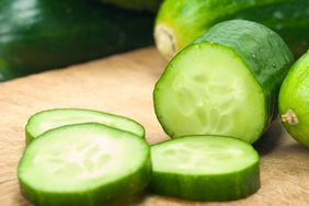 Sliced cucumbers on cutting board