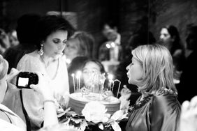 Darcy Miller and Martha Stewart with a birthday cake