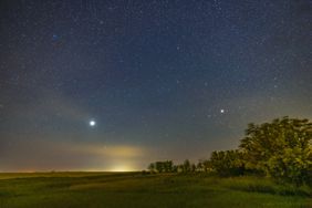 Jupiter (bright at left in Pisces) and Saturn (dimmer at right in Capricornus) low in the southeast sky on a mid-September evening in 2022