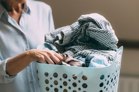 Woman holding laundry basket