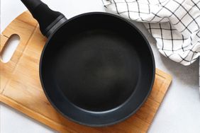 Non-stick pan with cutting board and napkin