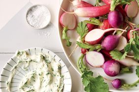 overhead view of radishes and herb dip