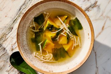 miso soup with winter squash and mushrooms in bowl