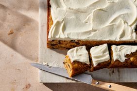 spiced squash cake with cream cheese frosting and a knife