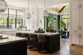 A timeless kitchen with glass pendant lights