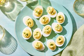 overhead view of hard boil eggs on a blue plate