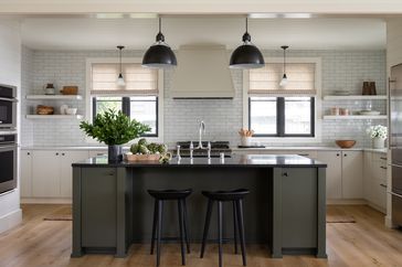 black-and-white kitchen with green kitchen island