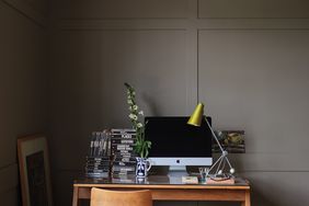 wooden desk in brown-painted at home office