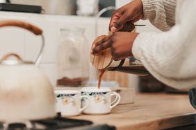 pouring coffee into coffee cups