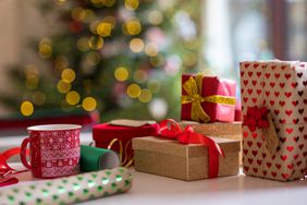 christmas gifts with christmas tree in background