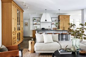 open concept living room and kitchen in neutral tones with light wood