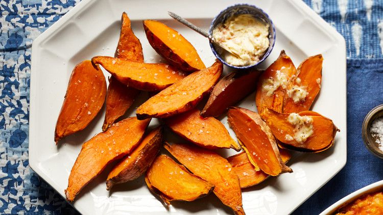 slow-baked sweet potatoes served on a white plate