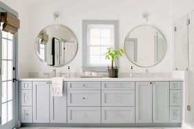 modern spa-like bathroom vanity with two round mirrors