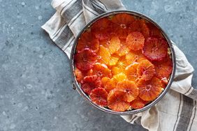 Orange Almond Cake batter topped with orange and blood orange slices in a springform baking pan