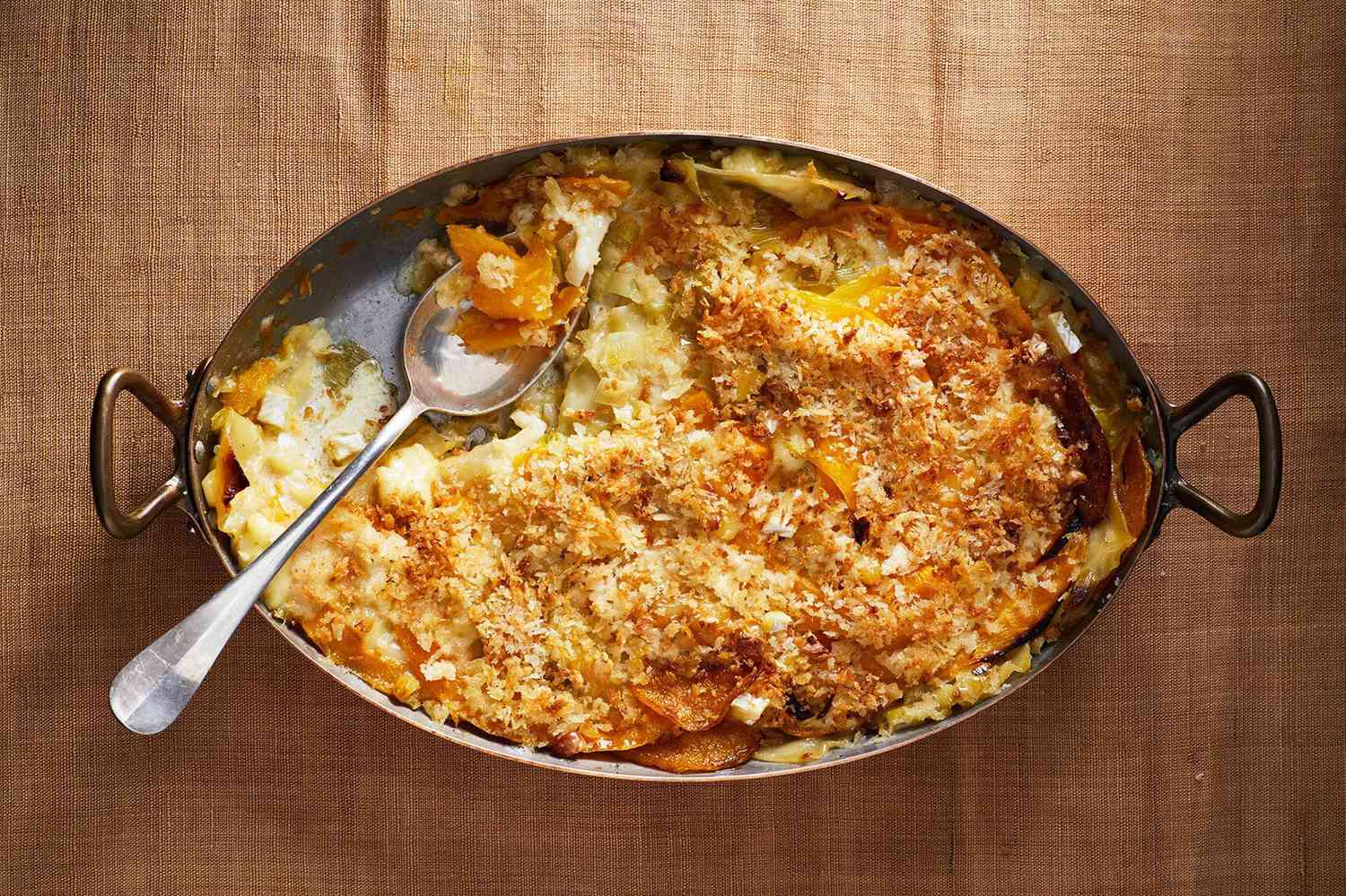 squash gratin served in a silver dish