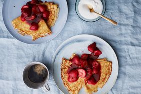 plated strawberry flambe crepes with coffee and cream