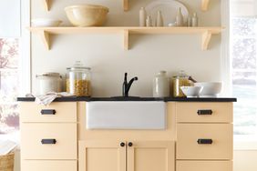 butter yellow kitchen with open shelving