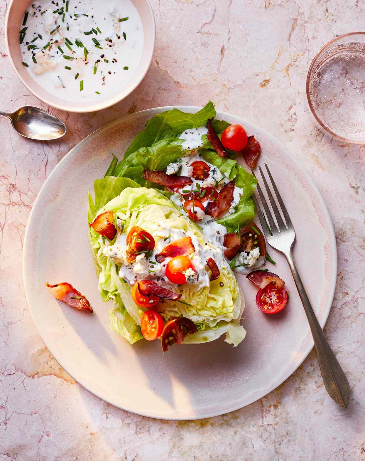 wedge salad served with buttermilk-blue-cheese dressing