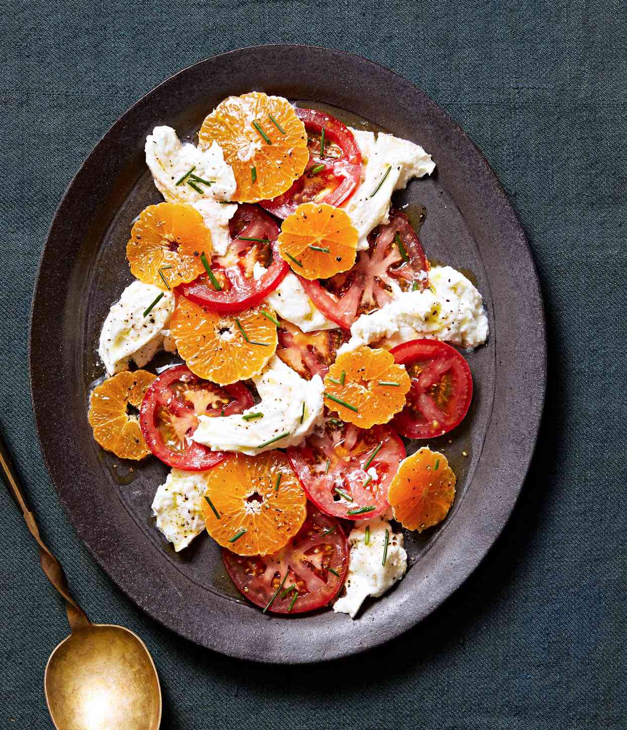 winter caprese salad topped with chives