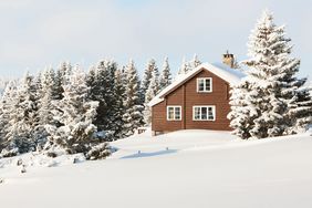 Log cabin in the snow